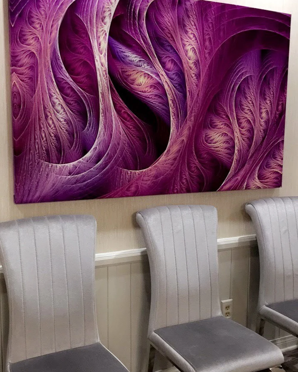 Purple painting and treatment chairs in the Smiles by Eddie office