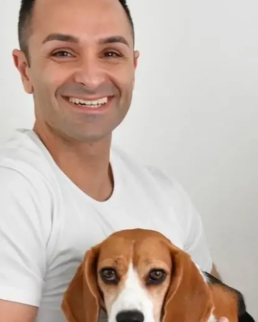 Dr. Edmond Ahdoot smiling with his dog