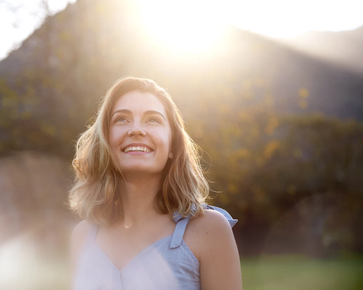 Smiling patient outdoors for Periodontics at Smiles by Eddie